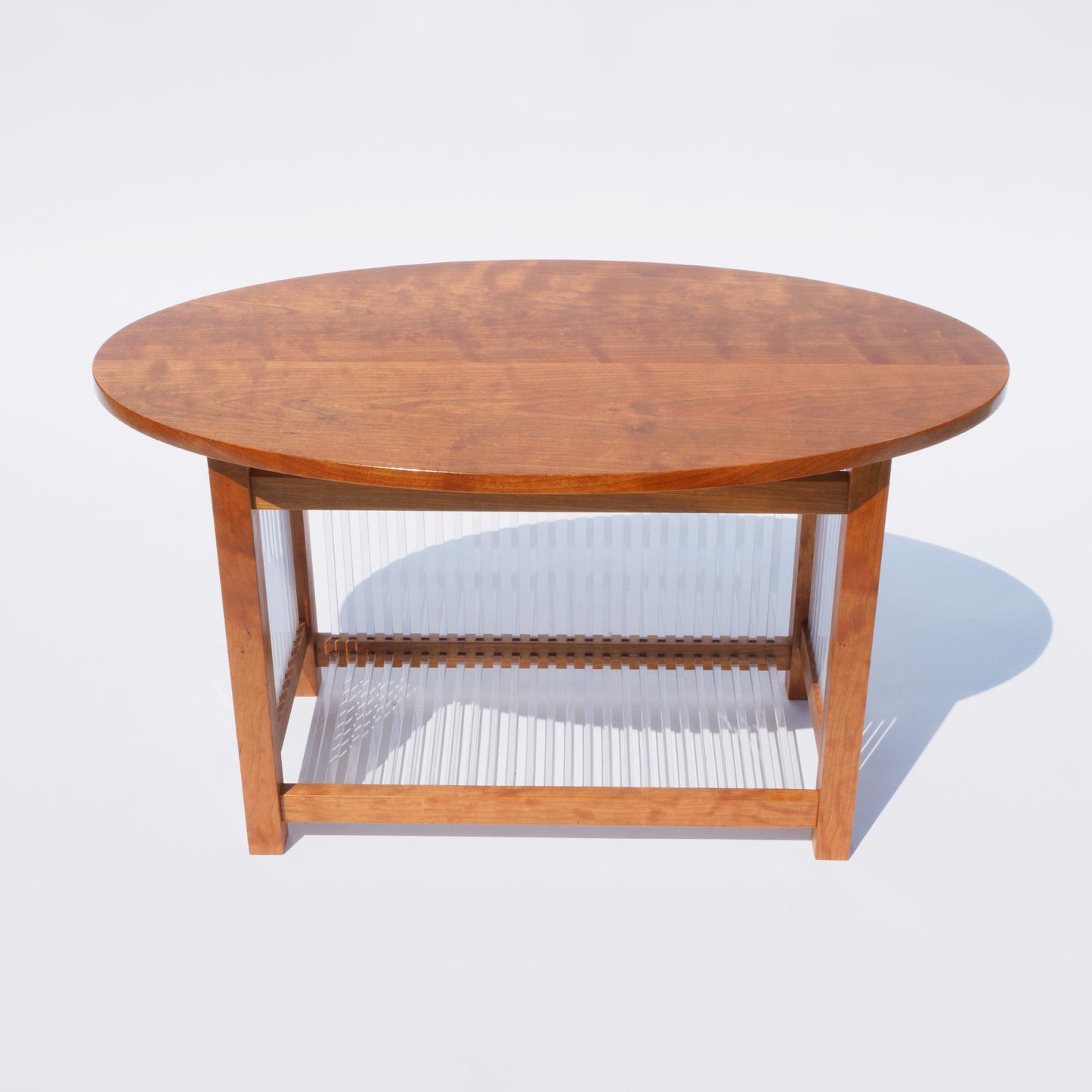 43 Oval Cherry and Polycarbonate End Table