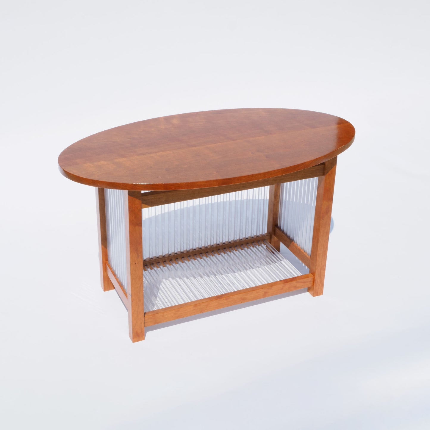 43 Oval Cherry and Polycarbonate End Table