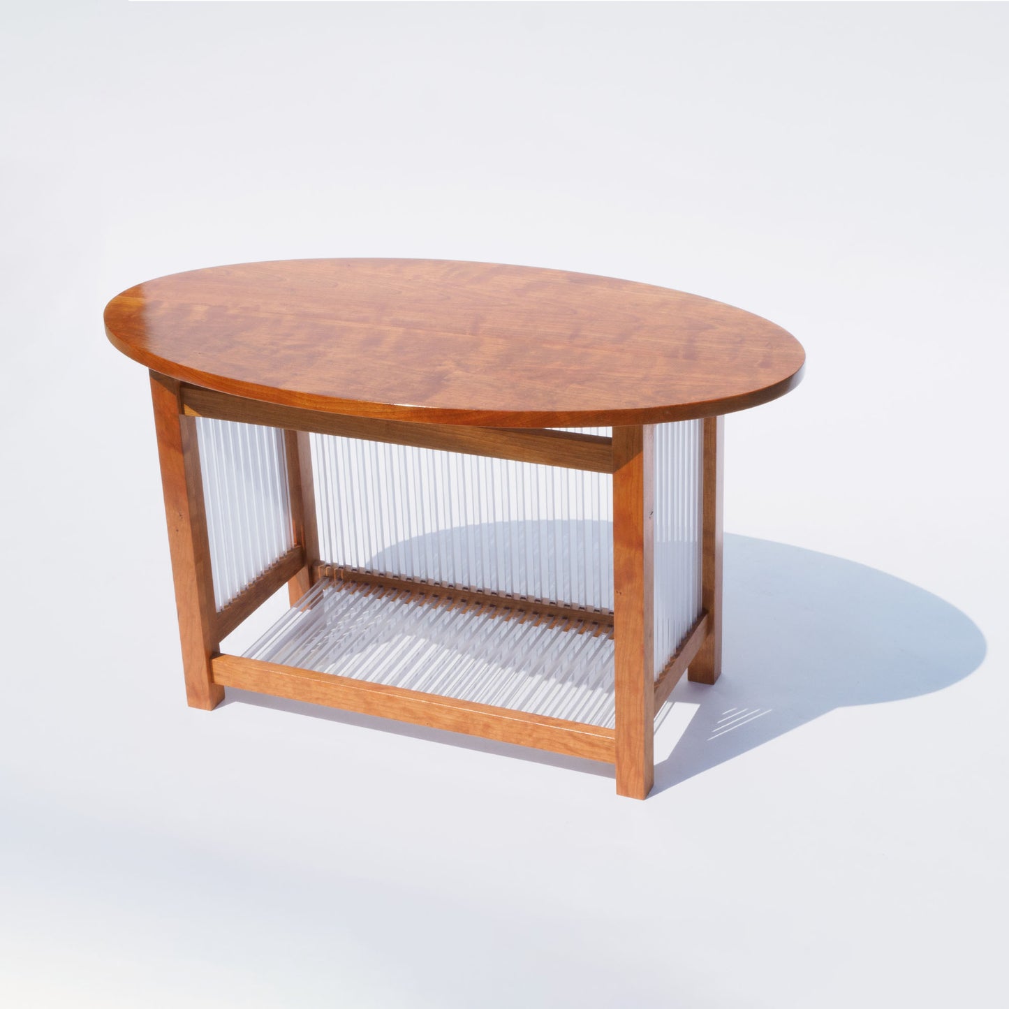 43 Oval Cherry and Polycarbonate End Table